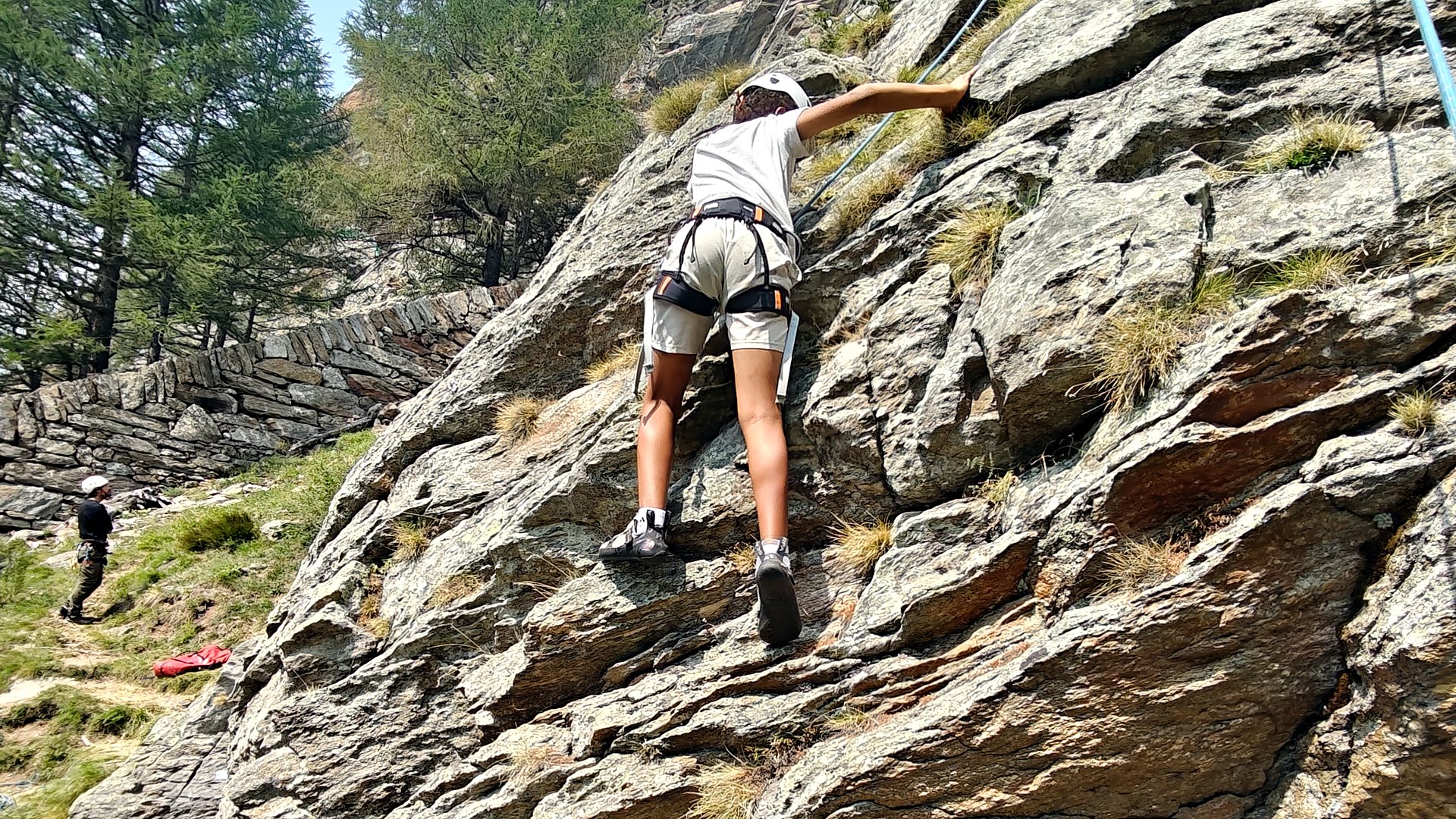 Alpine Challenger climbing a rock route in Saas-Fee